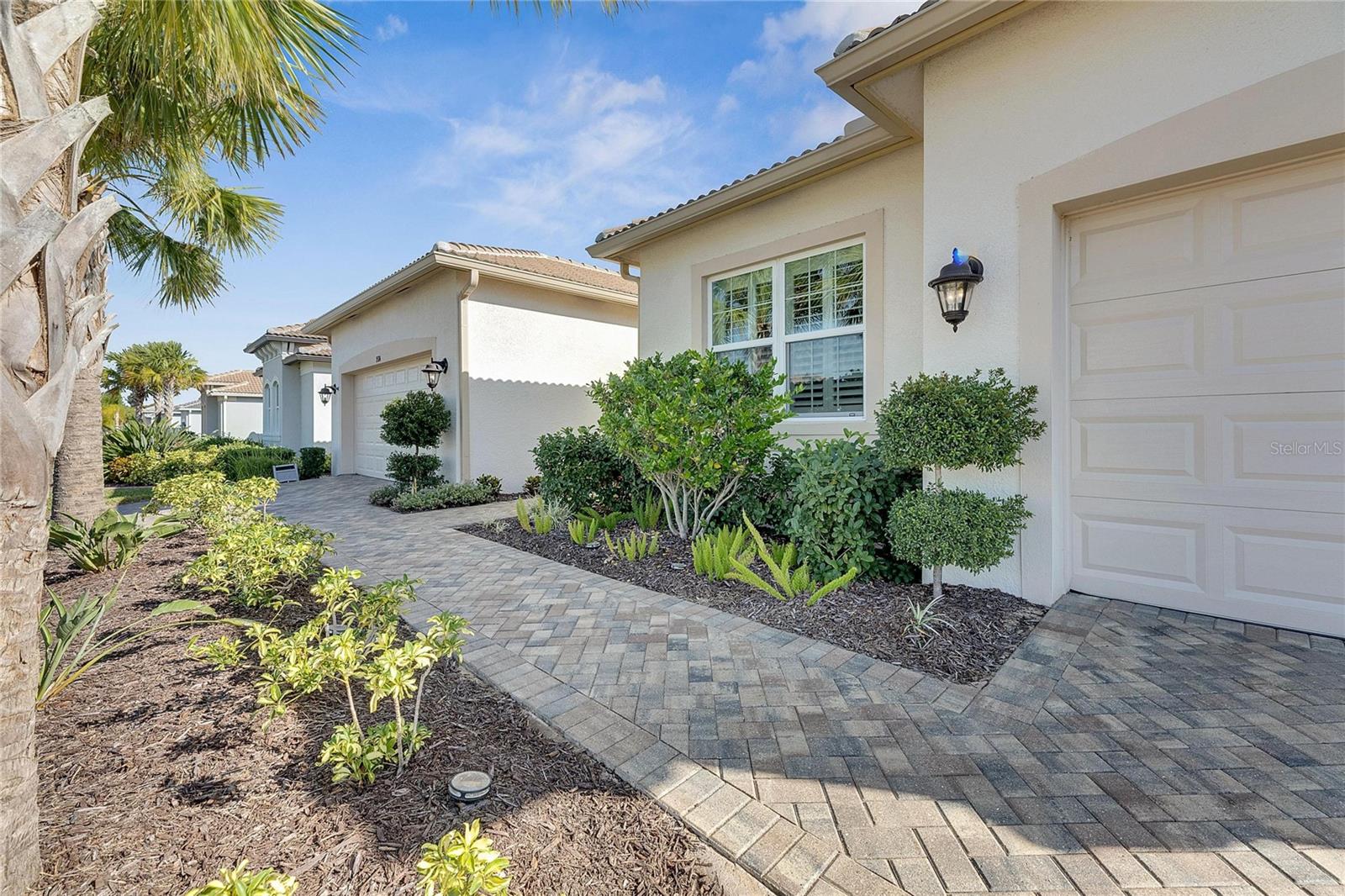 Two Car Garage on Left and One Car Garage on the Right of Home Entry