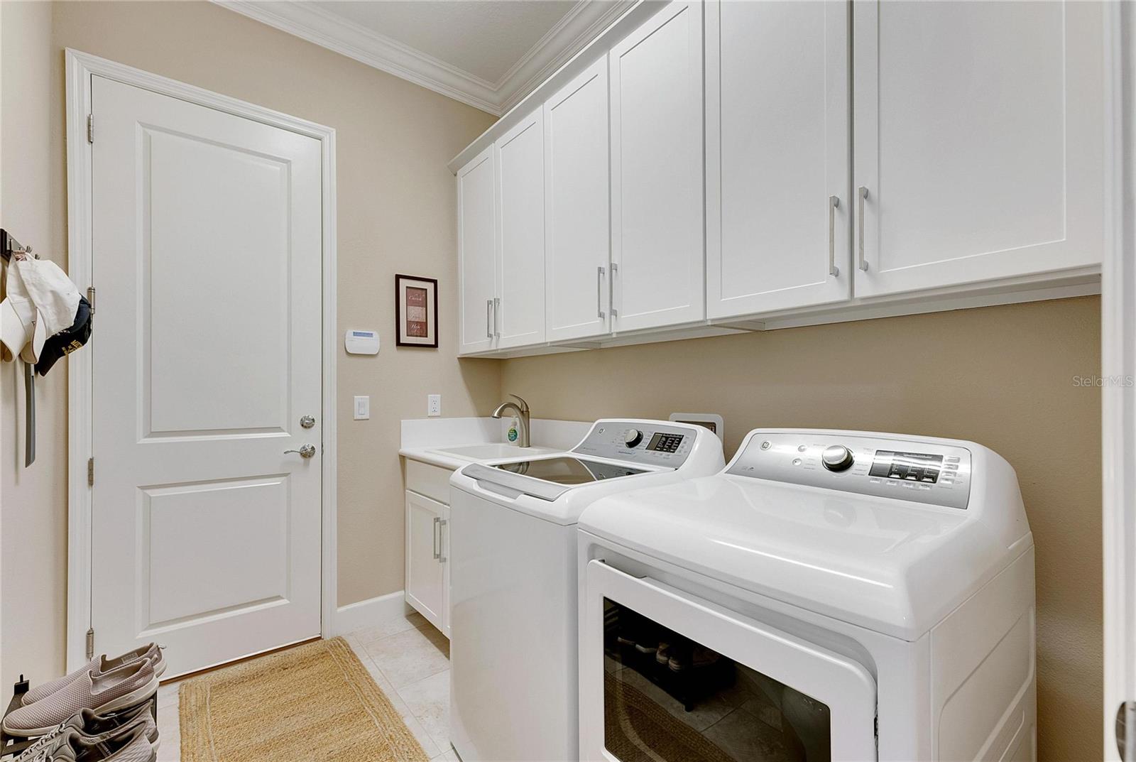 Laundry Room Opens to the Two Car Garage