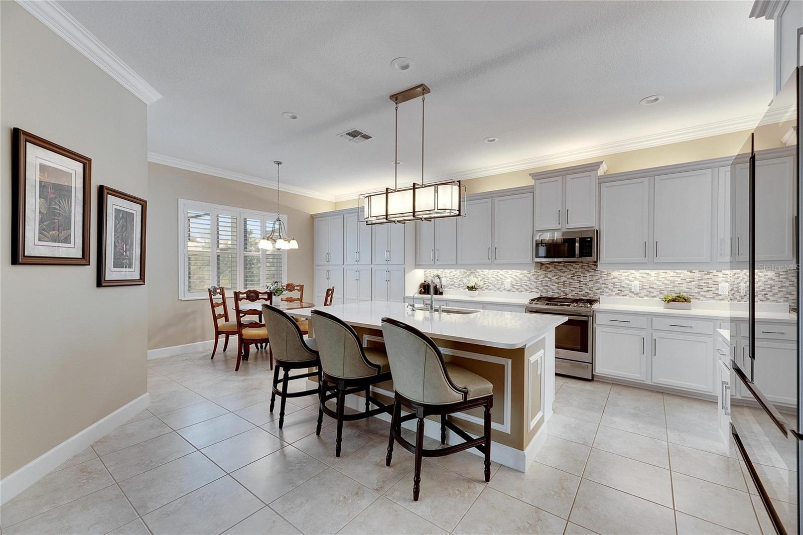 Spacious Kitchen With Upgraded Cabinets and Plenty Of Lighting.