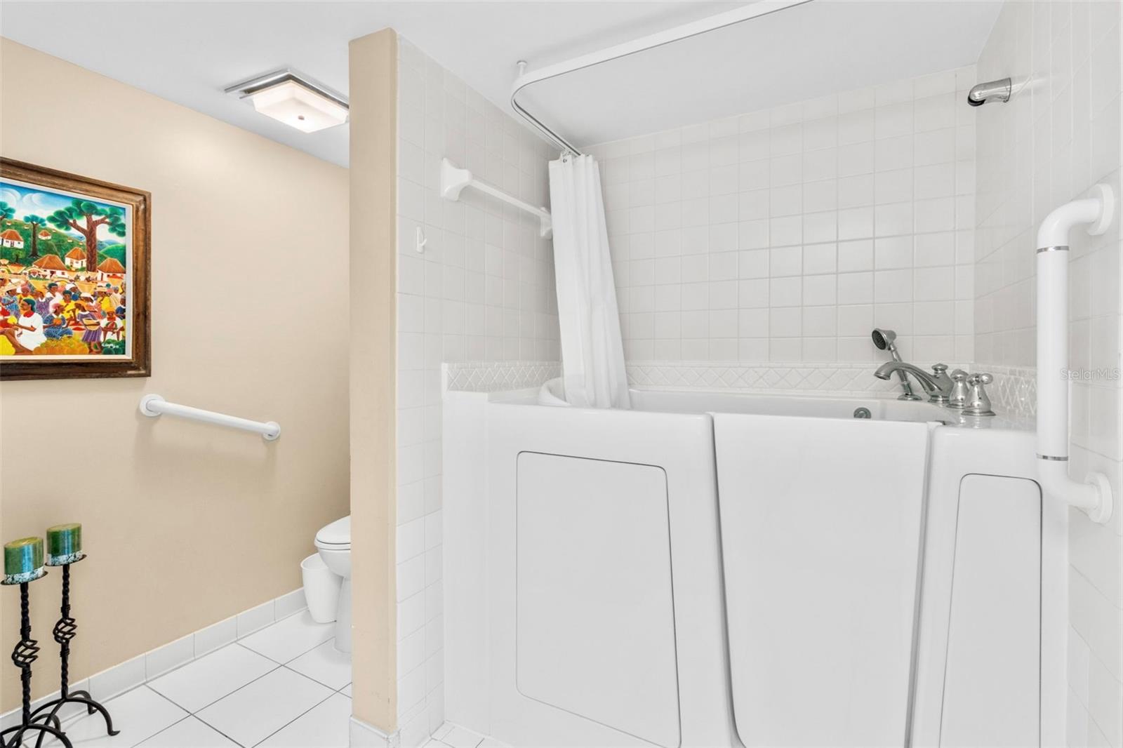 Primary Bathroom boasts walk in tub AND walk in shower in a separate space.