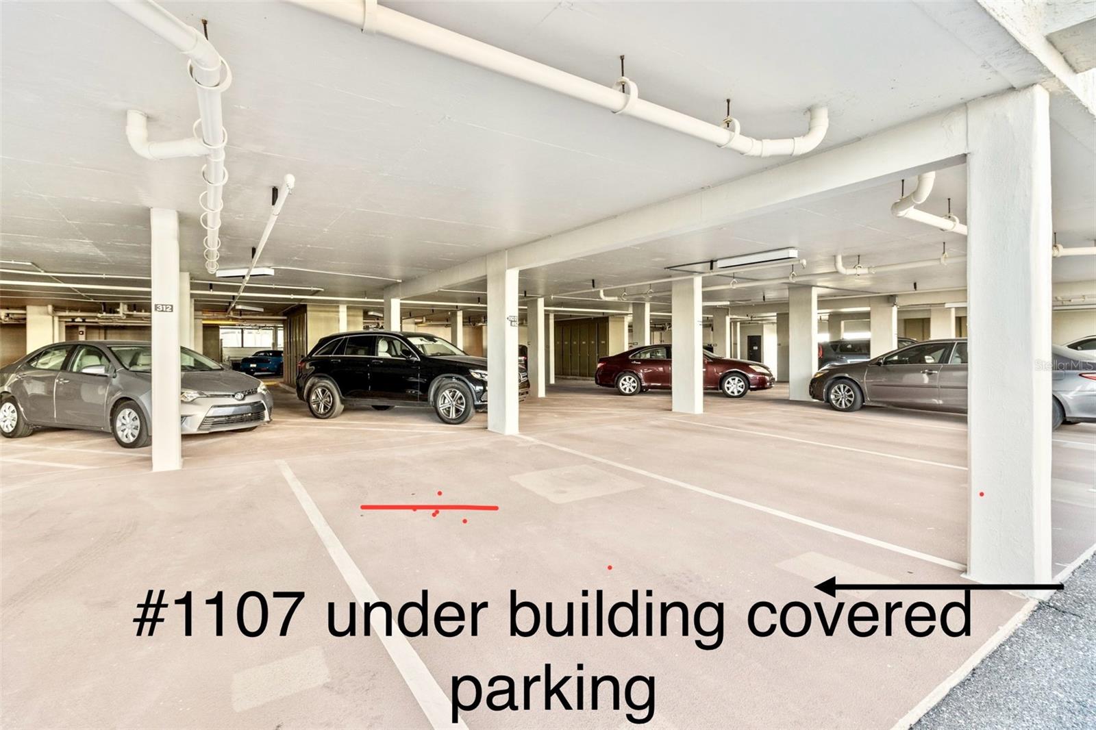 Covered under building parking space is assigned to #1107