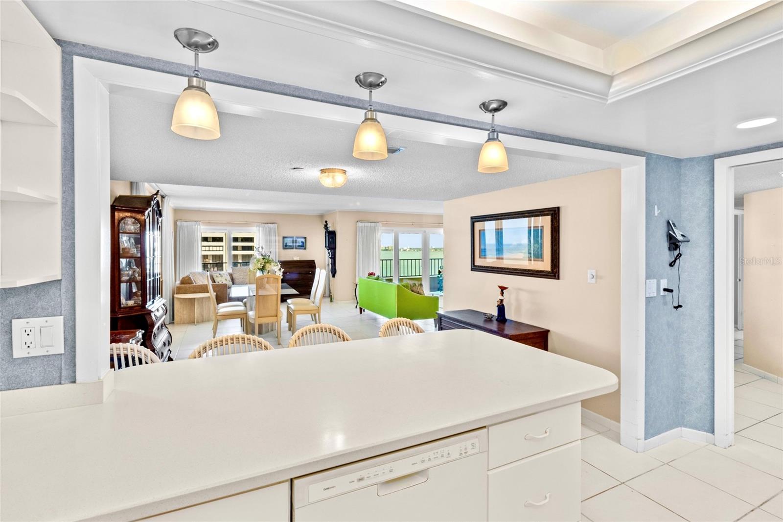 Kitchen Island/breakfast bar opens to Living/dining area.