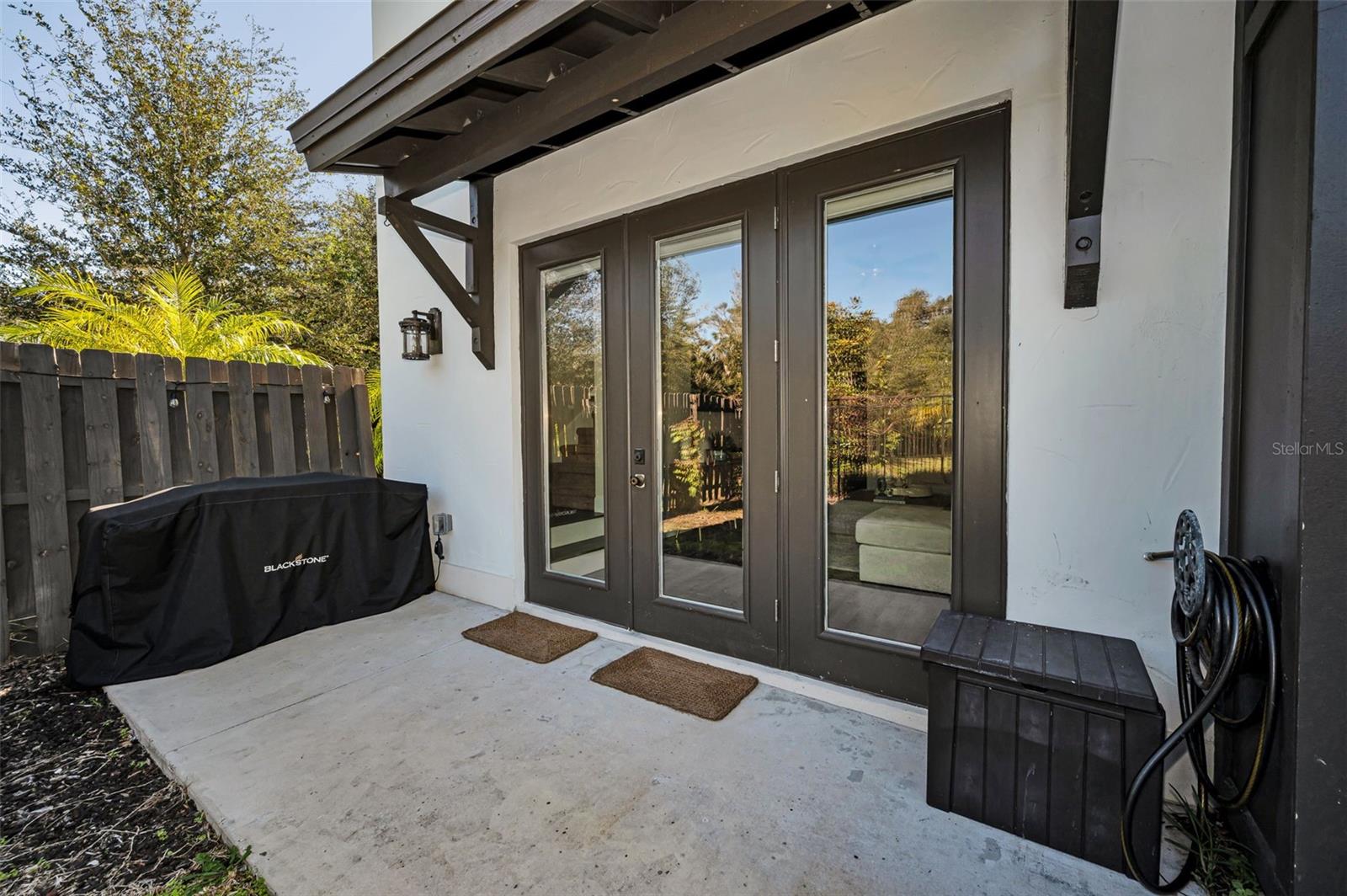 Rear yard with french doors to home