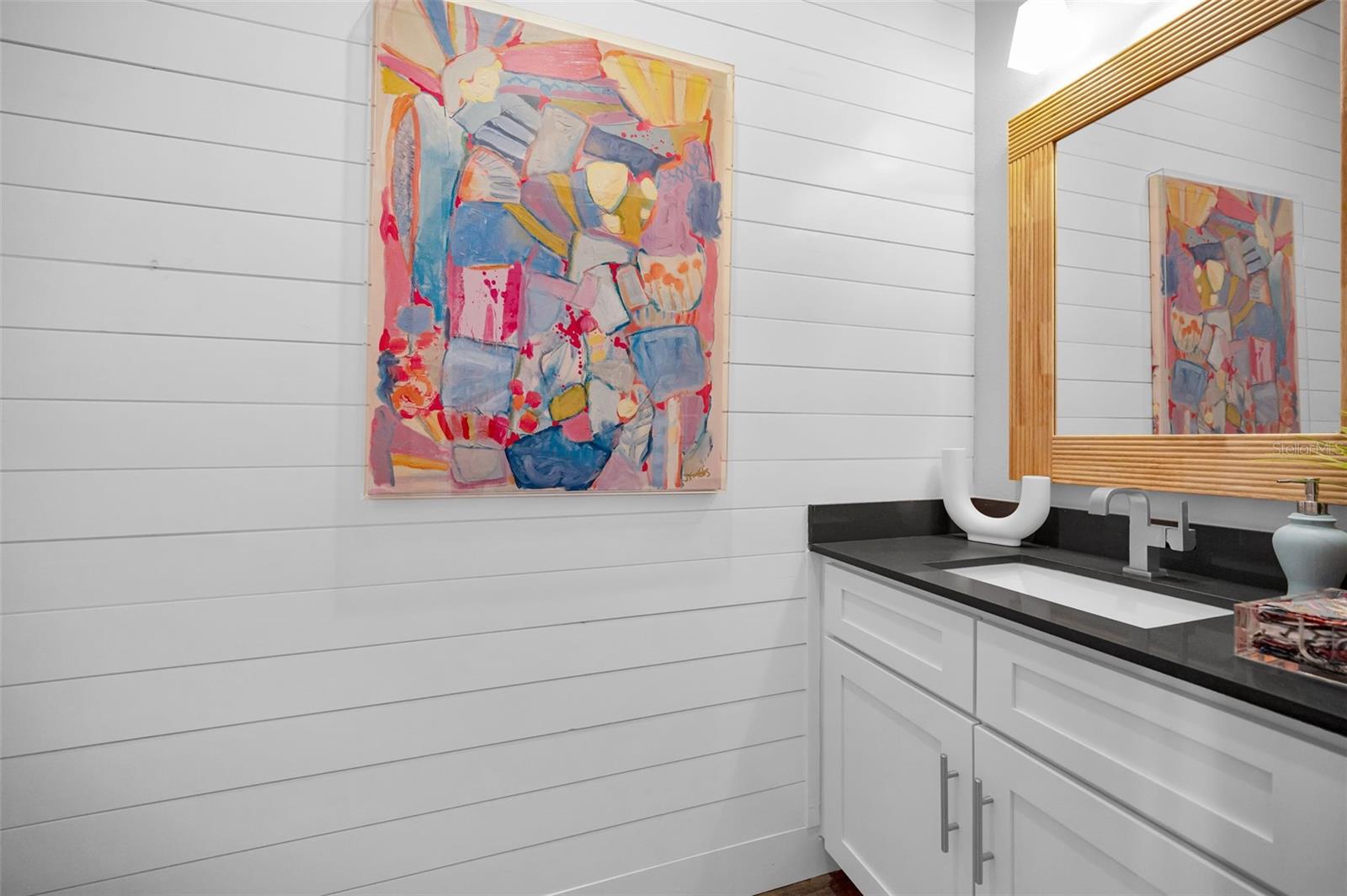 Foyer half bath w/ shiplap accent wall