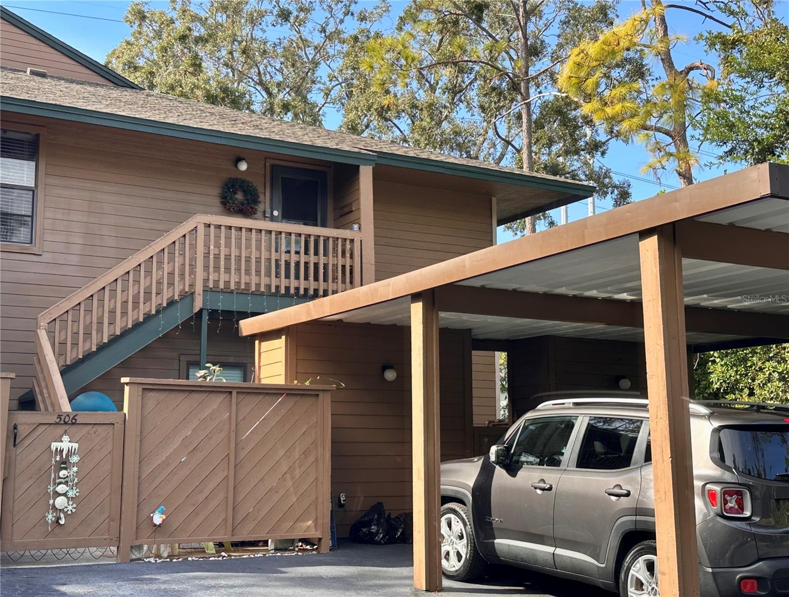 Carport and storage unit right in front.