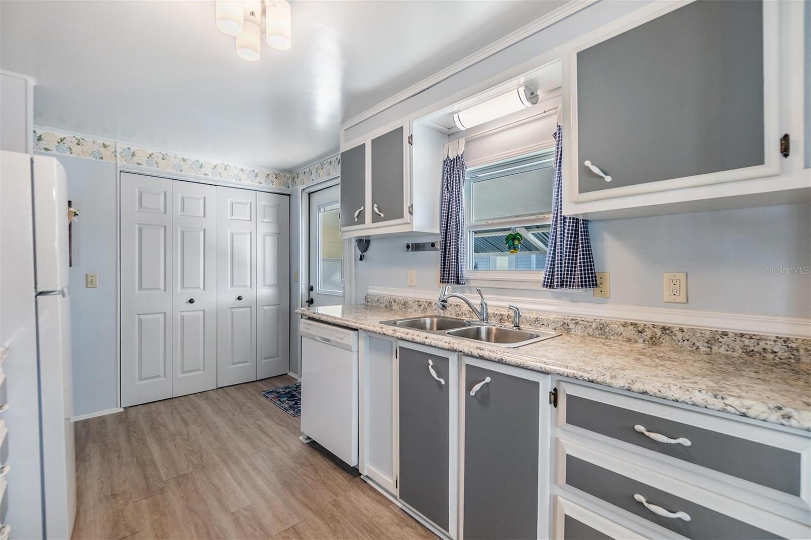 Large closet pantry with bifold doors.