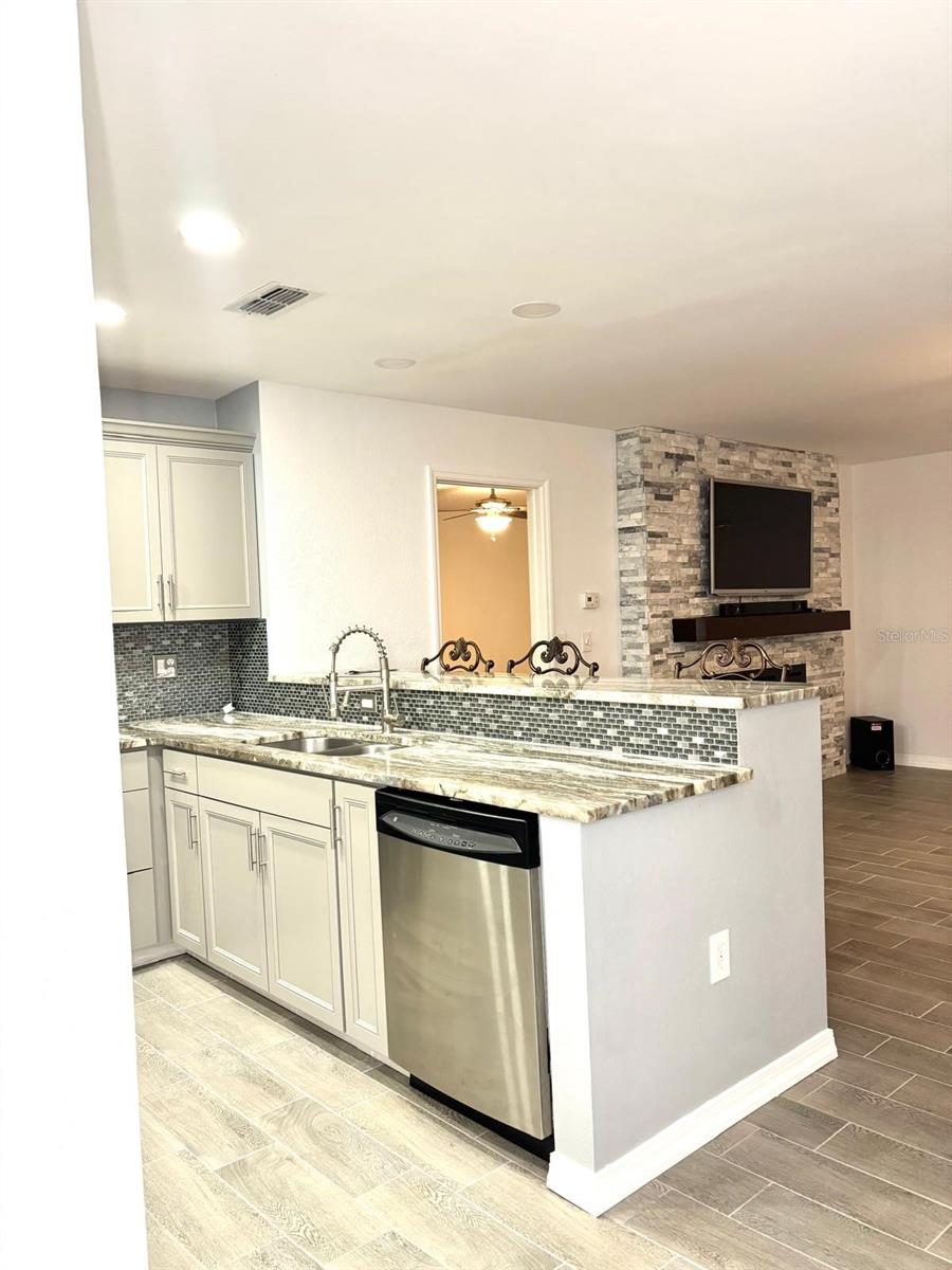 kitchen, with living room in background