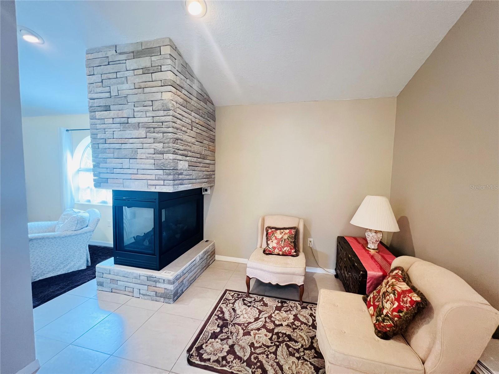 BEDROOM FIREPLACE VIEW FROM BEDROOM AND SITTING AREA