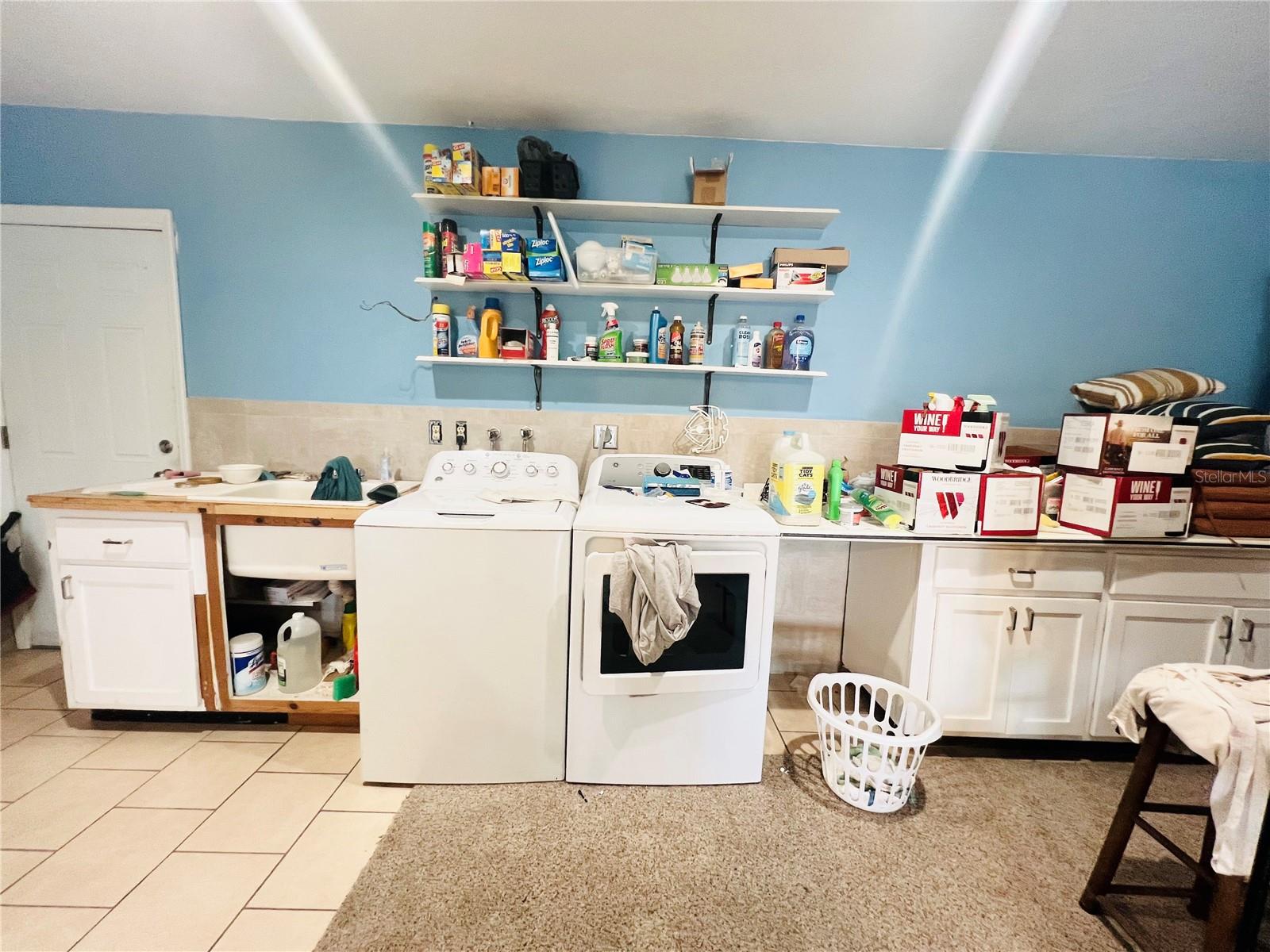 LAUNDRY ROOM AND EXTRA STORAGE SPACE.