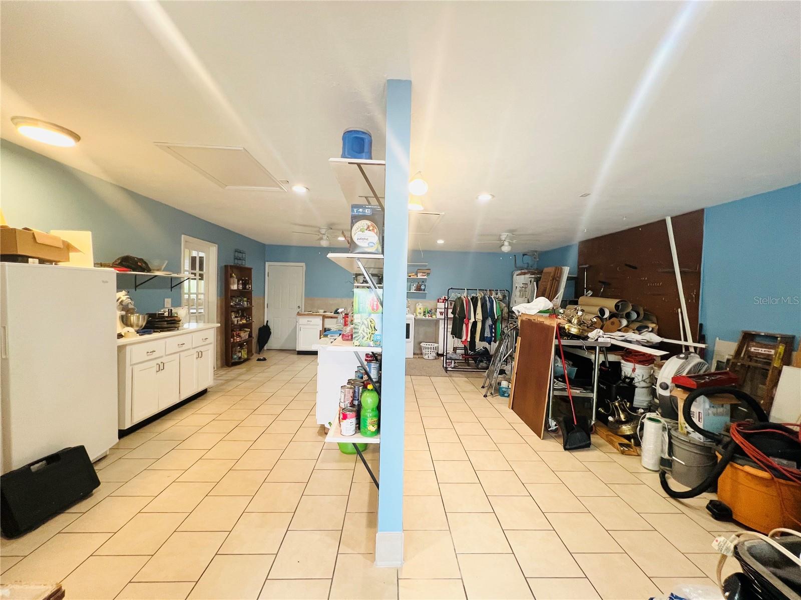 LAUNDRY ROOM AND EXTRA STORAGE ROOM, USED AS PANTRY ON LEFT SIDE AND STORAGE ON RIGHT SIDE