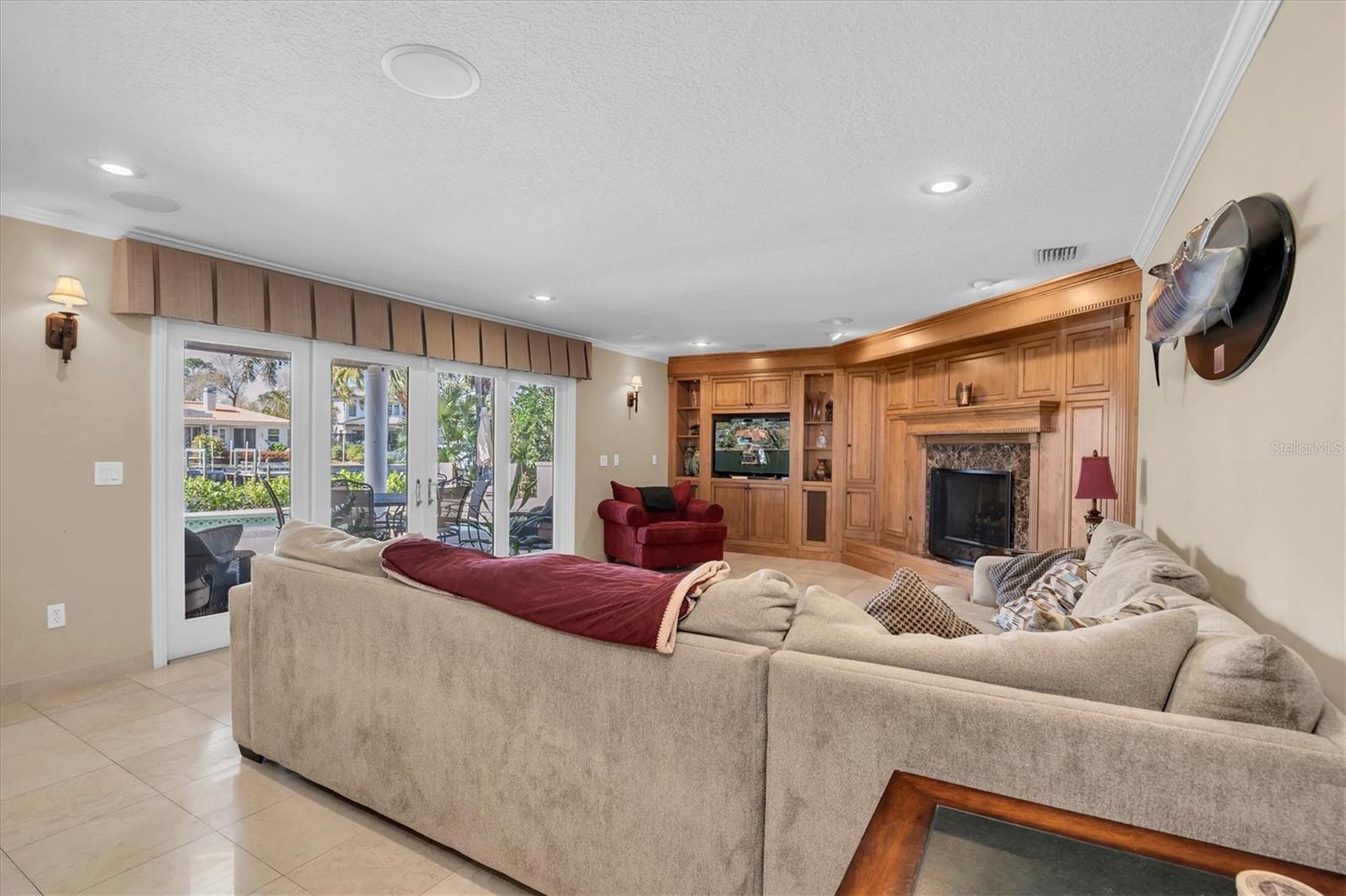 Large living area with fireplace and sliding doors