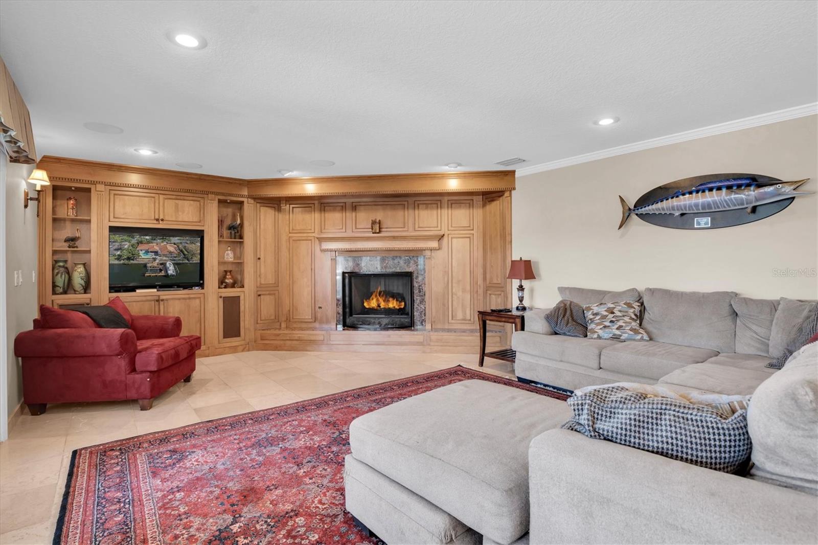 Built in bookshelves surround the wood burning fireplace