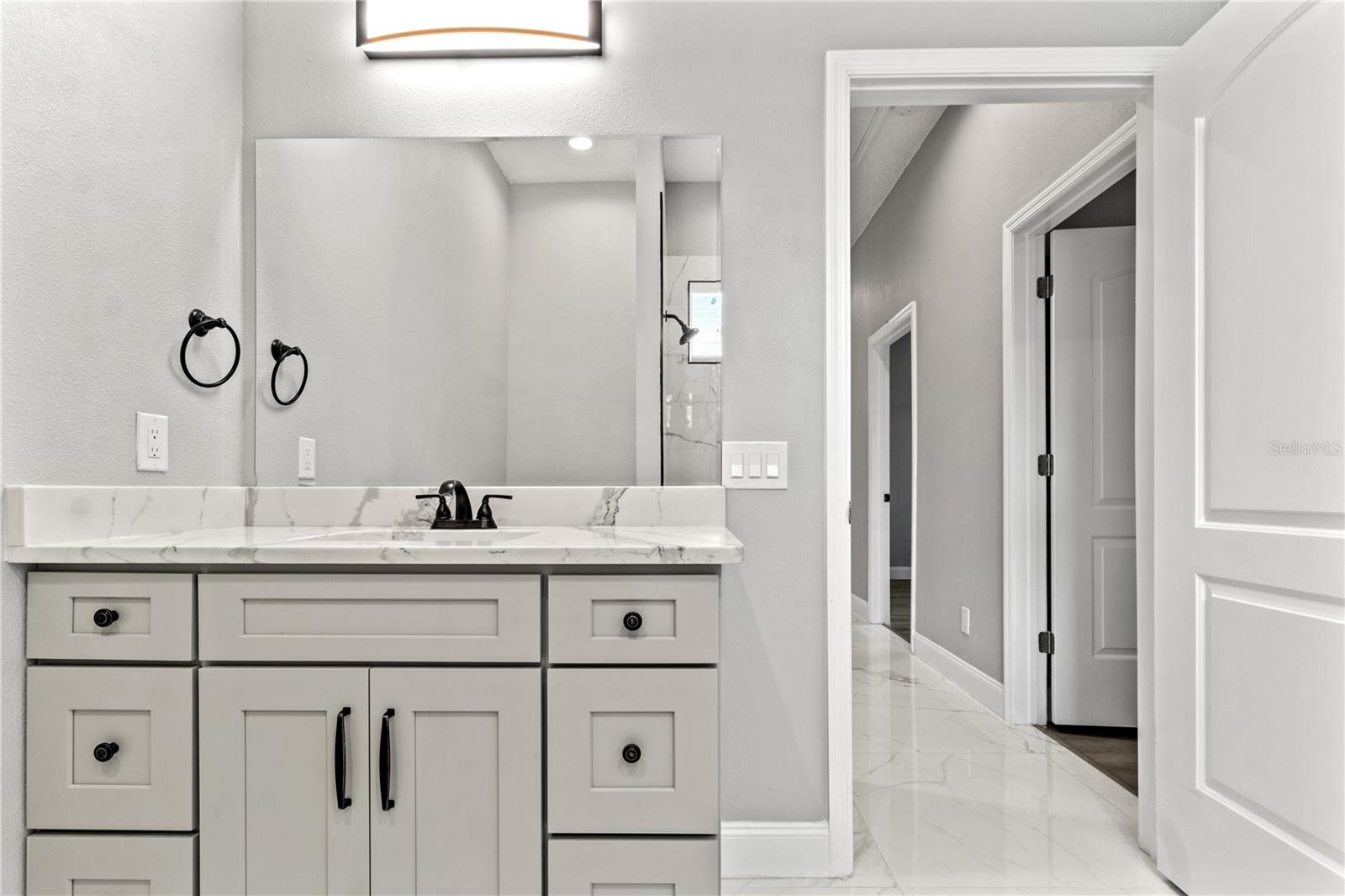 Main bathroom at the end of the hall from bedrooms 3 and 4