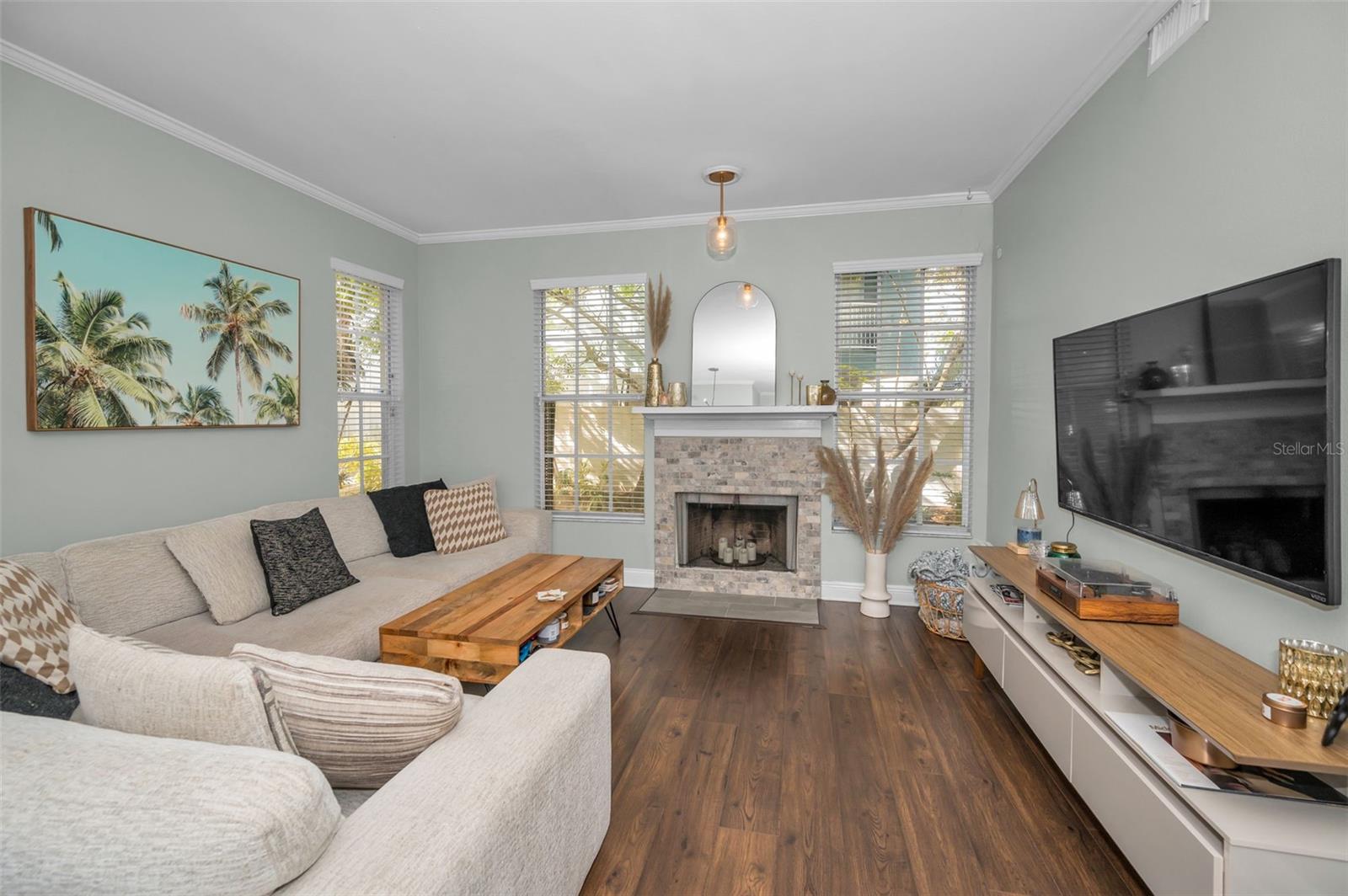 Gorgeous Living room with lots of windows a a fireplace