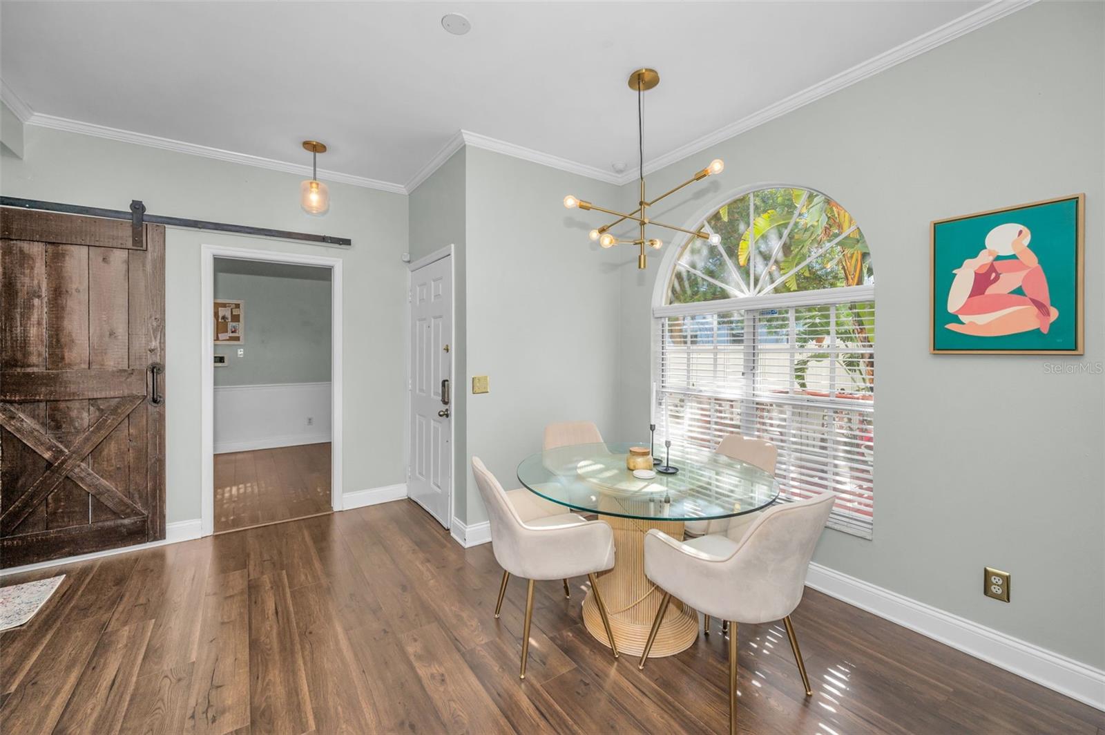 Dining area overlooks window to deck