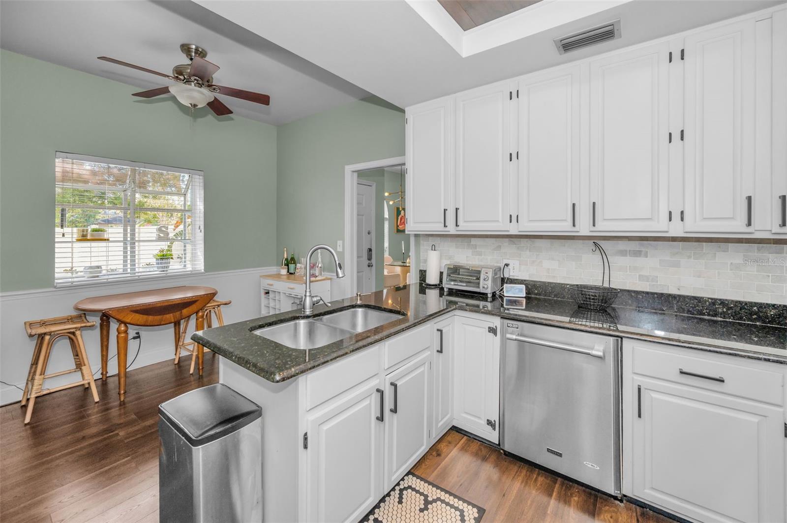 Kitchen overlooks eat in area and window