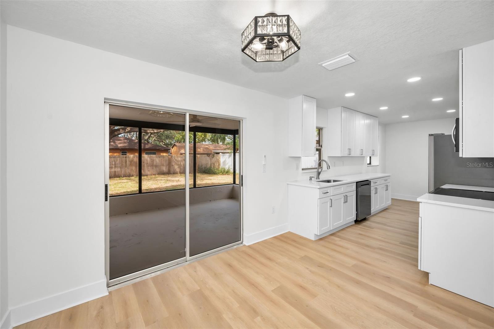 Dining Room with View of Kitchen and Screen Enclosed Back Porch