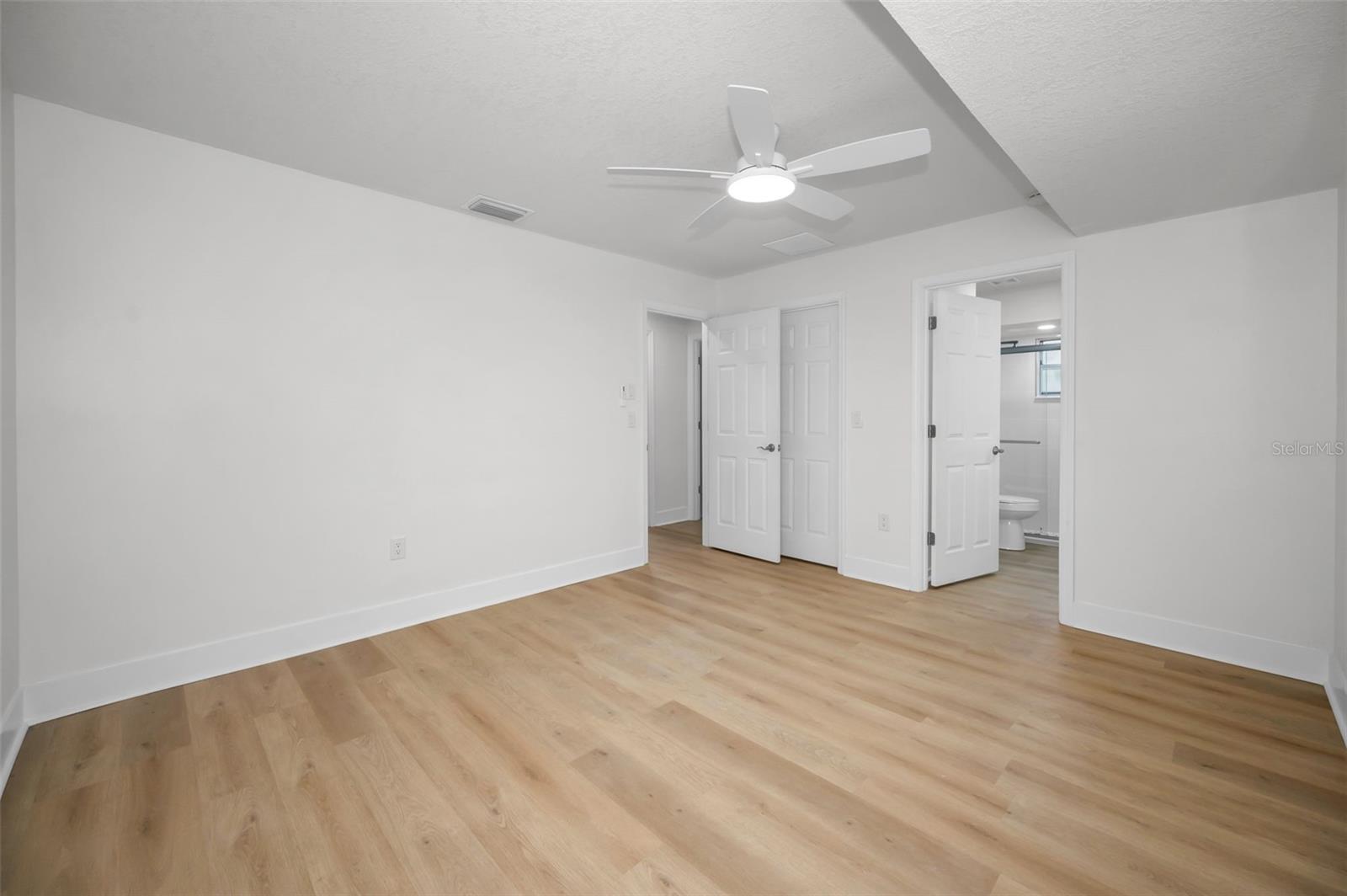 Primary Bedroom with Walk-in Closet and En Suite Bathroom