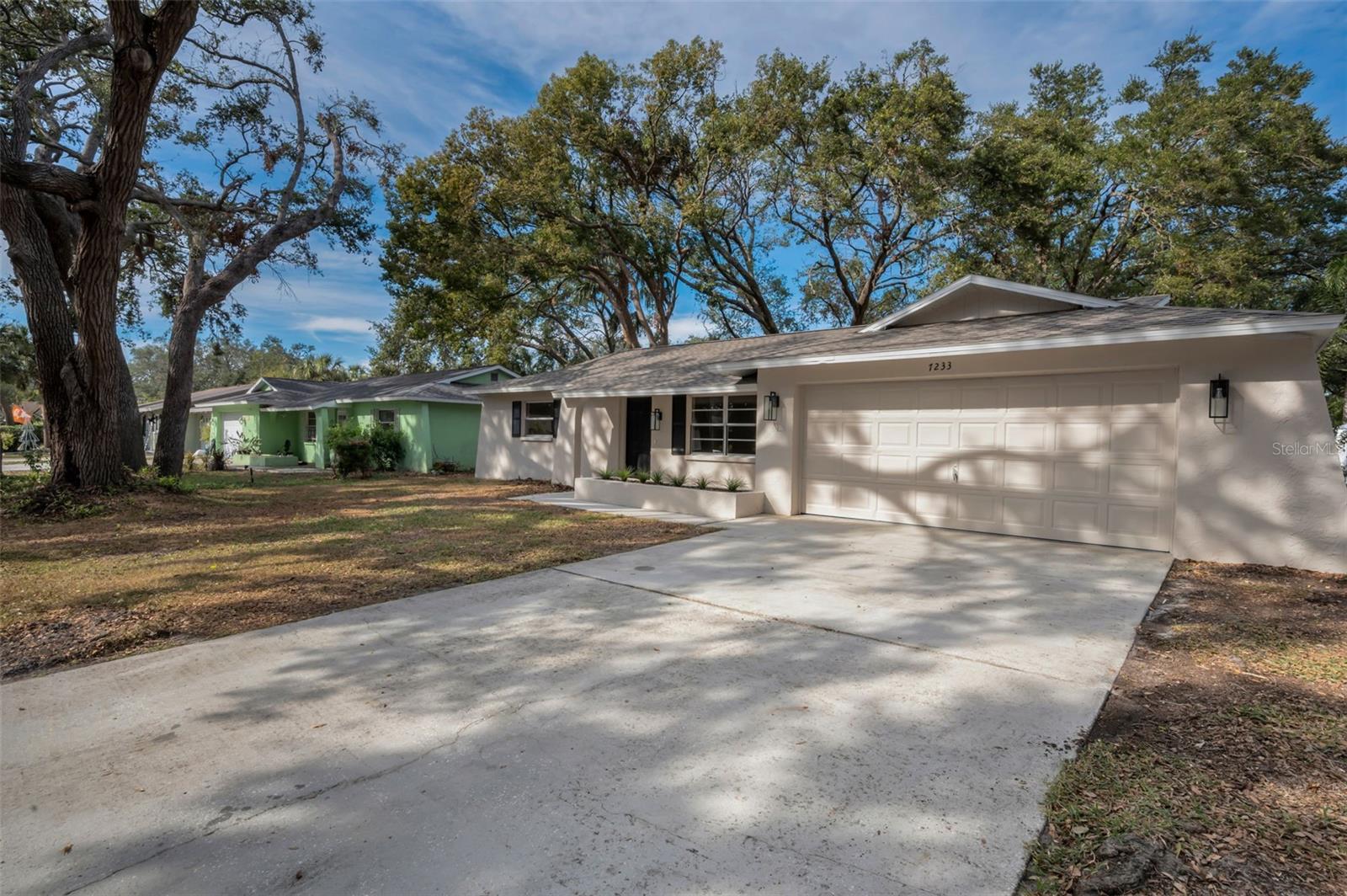 Front Exterior with Two Car Garage and Driveway