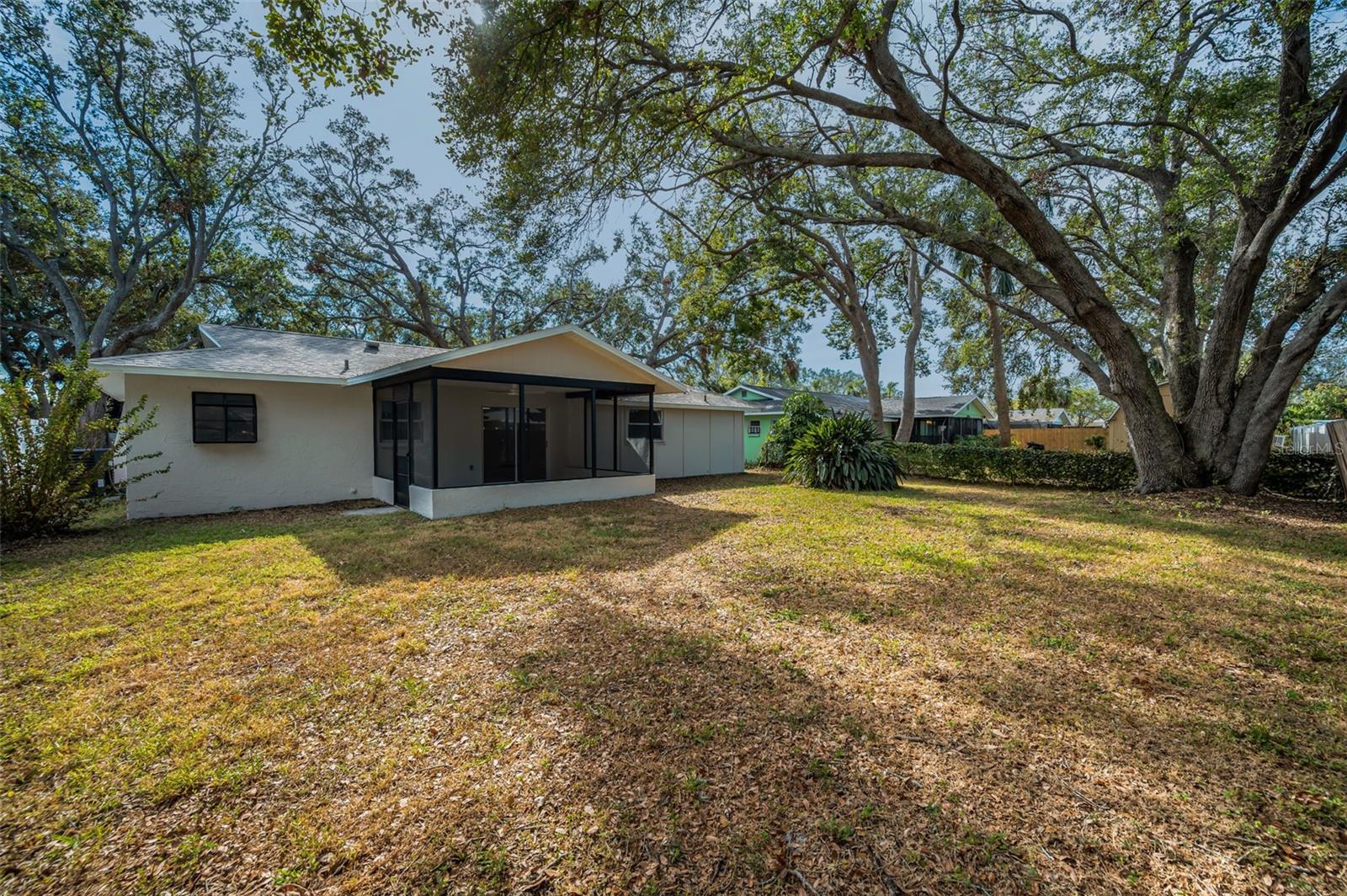 Backyard with Rear Exterior of House and Screen Enclosed Back porch