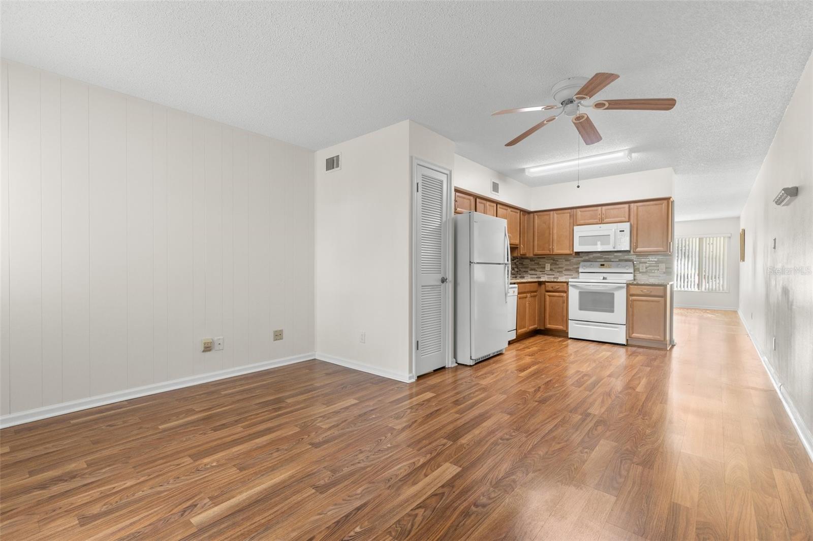 Kitchen/Den with eat-in space and access to back patio - large enough to provide space for a desk area too