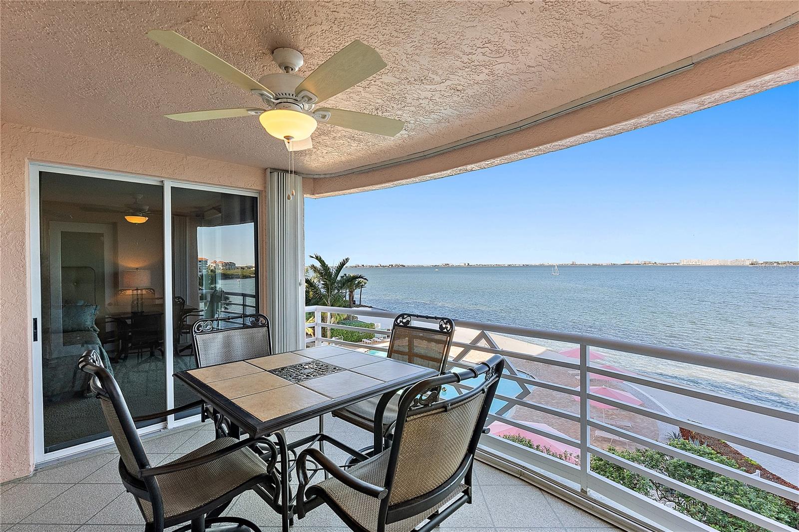 Balcony - storm shutters make it easy to lock and leave. The door in the photo leads to the primary bedroom