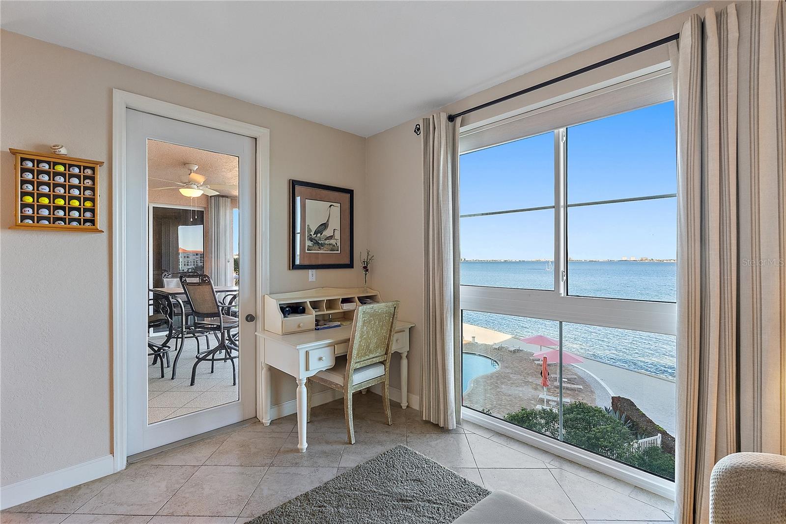 Sitting room off kitchen leads to balcony