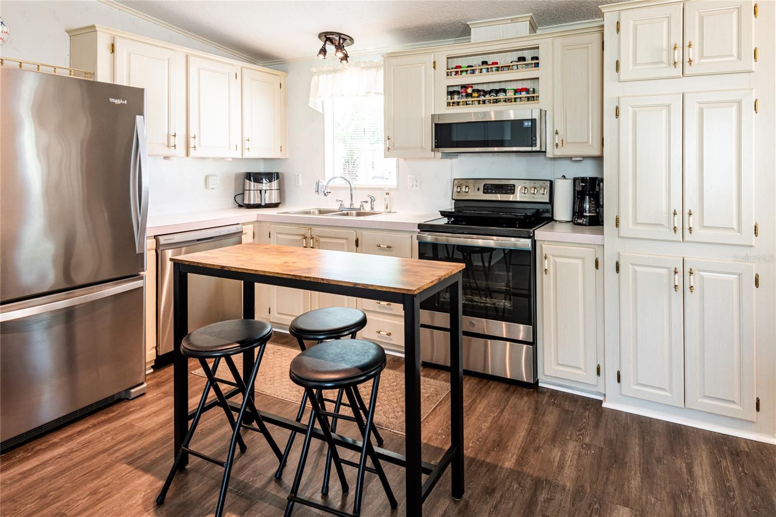 Super cool kitchen with all top of line stainless appliances, including the range with built-in air fryer.