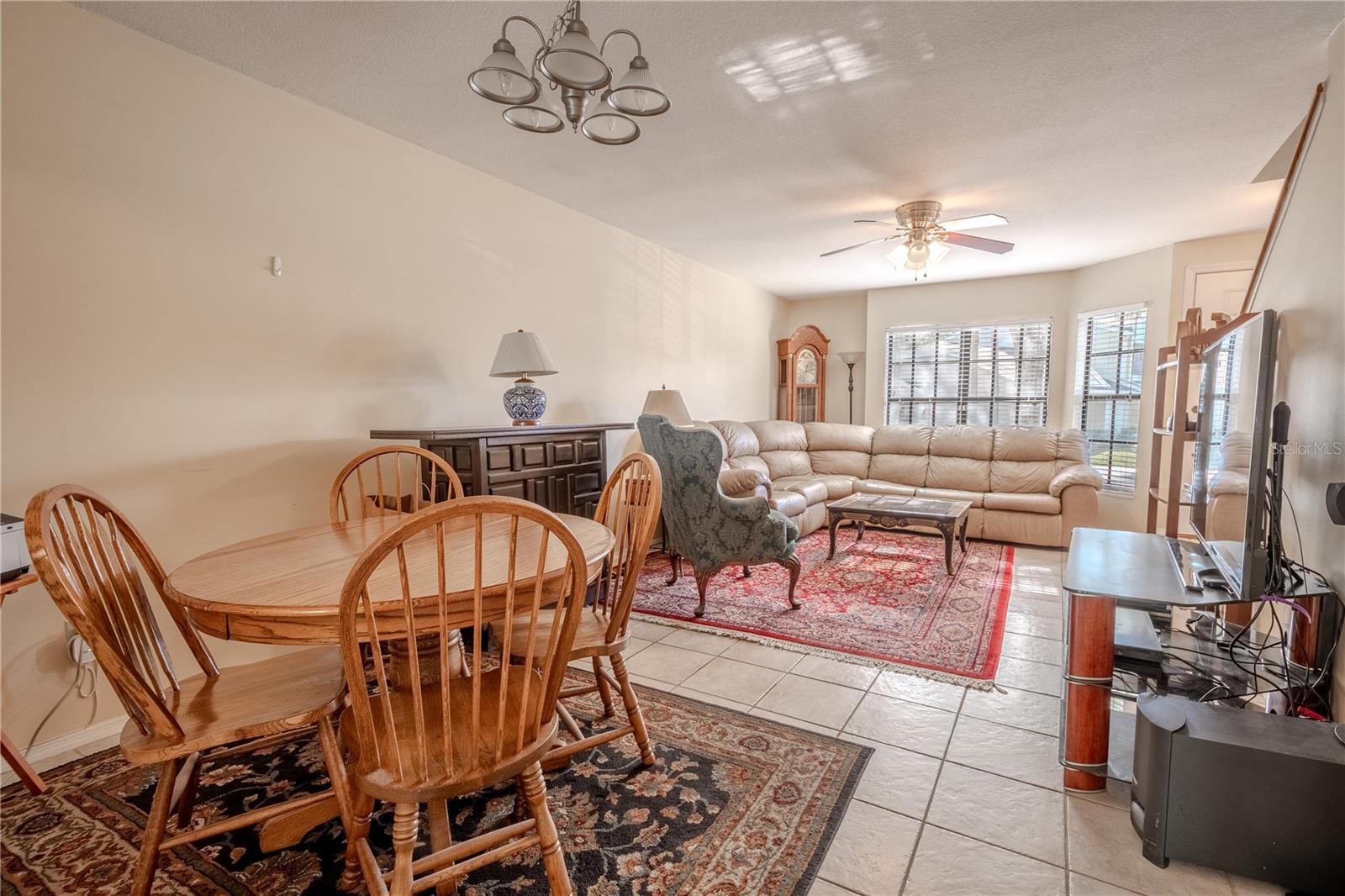 The dining room had a 5-light chandelier and is open to the living room.