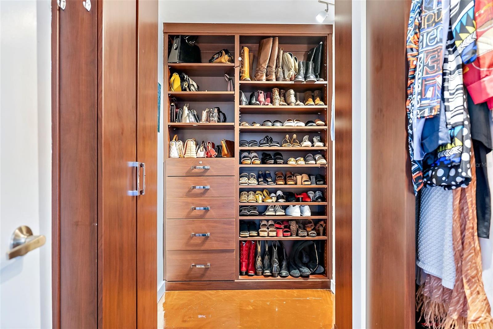 Oversized Primary Closet with Custom Built-ins