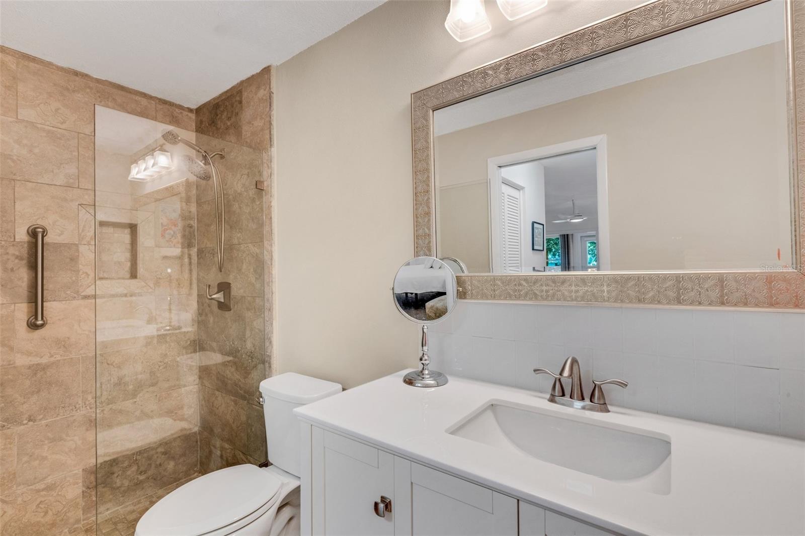 Updated en-suite with newer vanity & frameless enclosed walk-in shower~