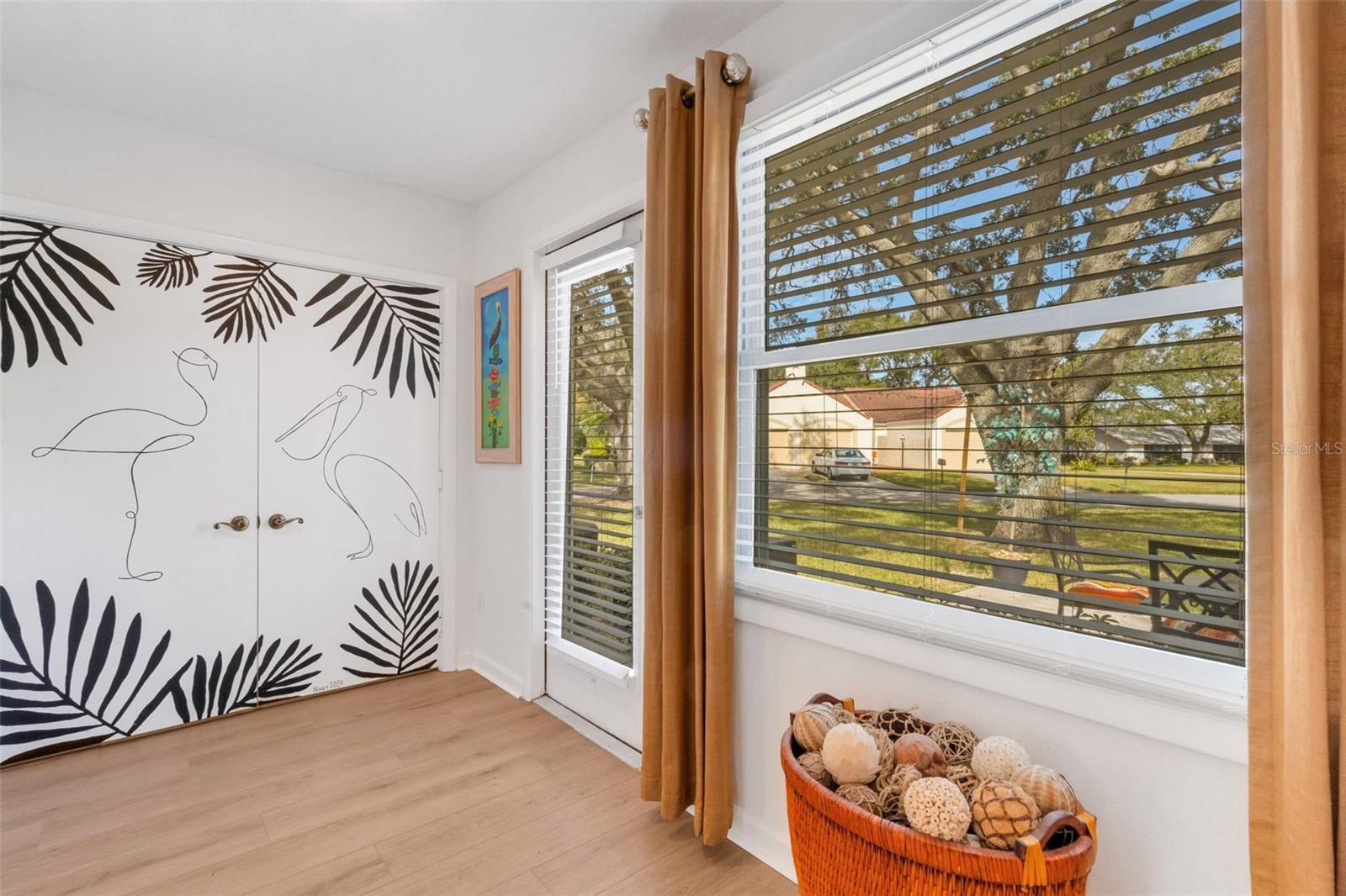 Laundry closet nicely tucked in corner & access to rear patio~