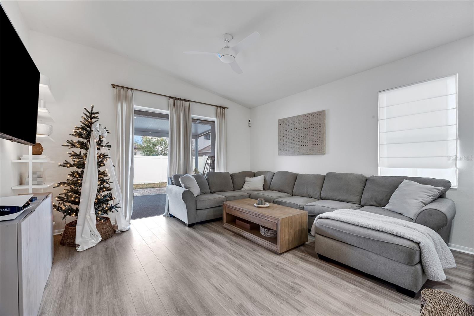 With plenty of natural light pouring in through the large sliding door into the backyard, the room feels open and airy.