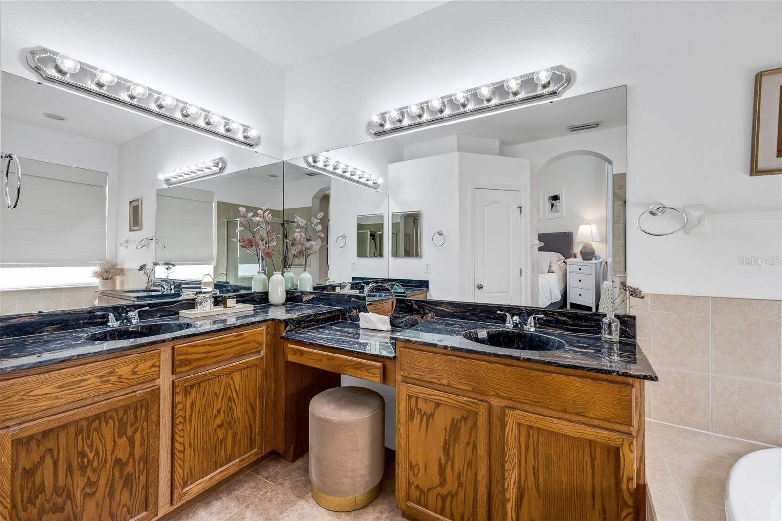 The vanities in the main bathroom include a make-up area.