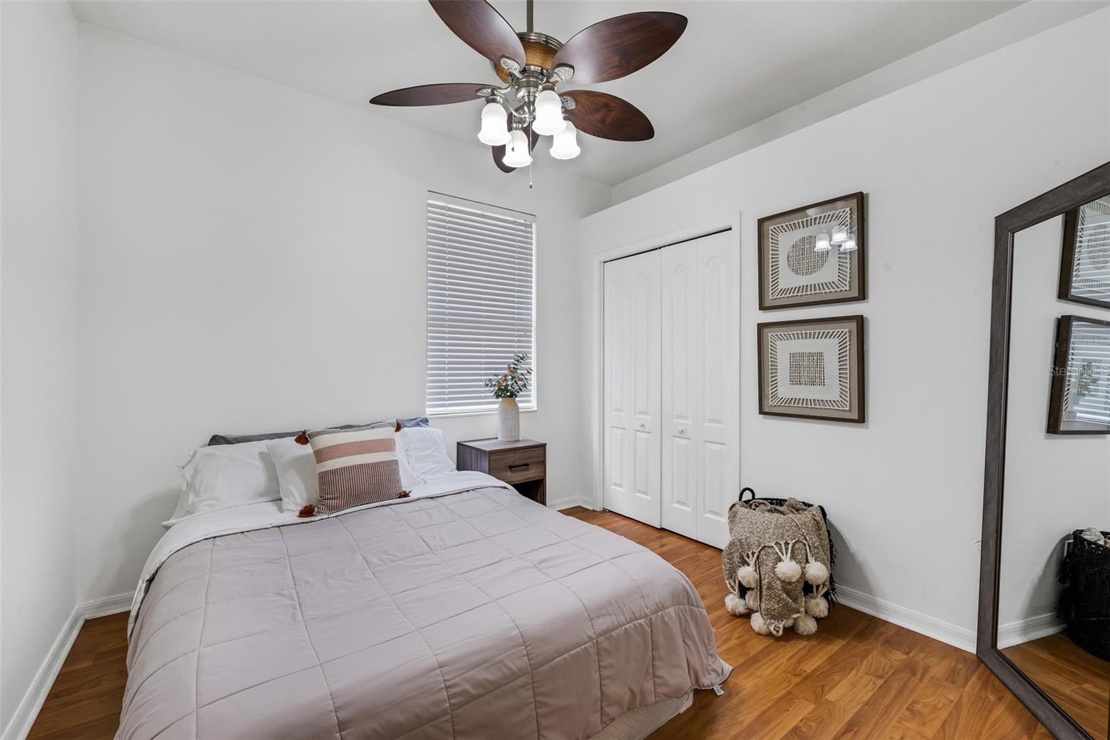 Secondary bedroom #4 is 10' x 12' and has laminate flooring and a built-in closet.