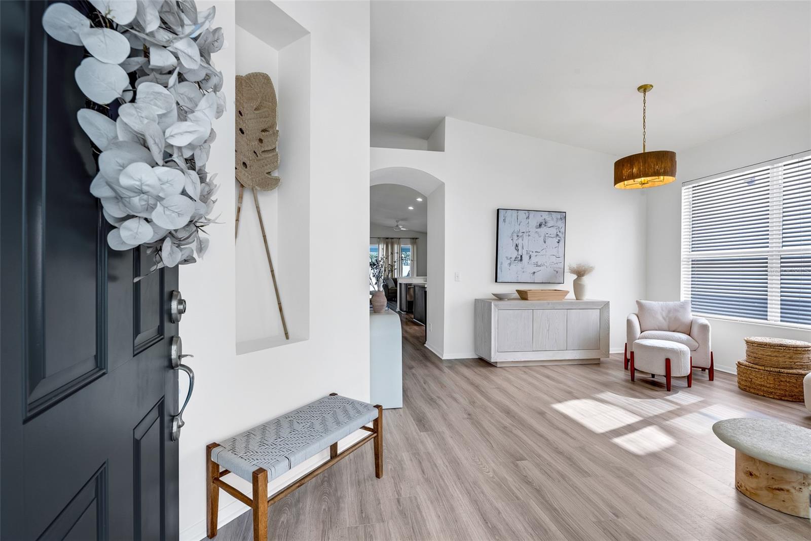 As you enter through the foyer, you’ll be immediately drawn to the open-concept living space.