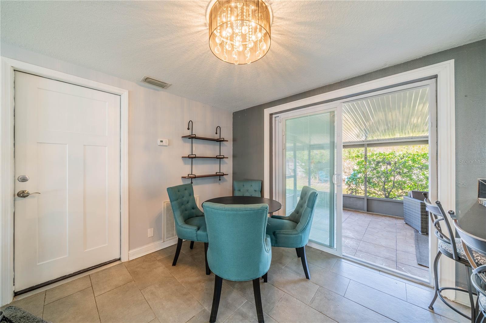 TILED DINING SPACE OFF THE SCREENED LANAI