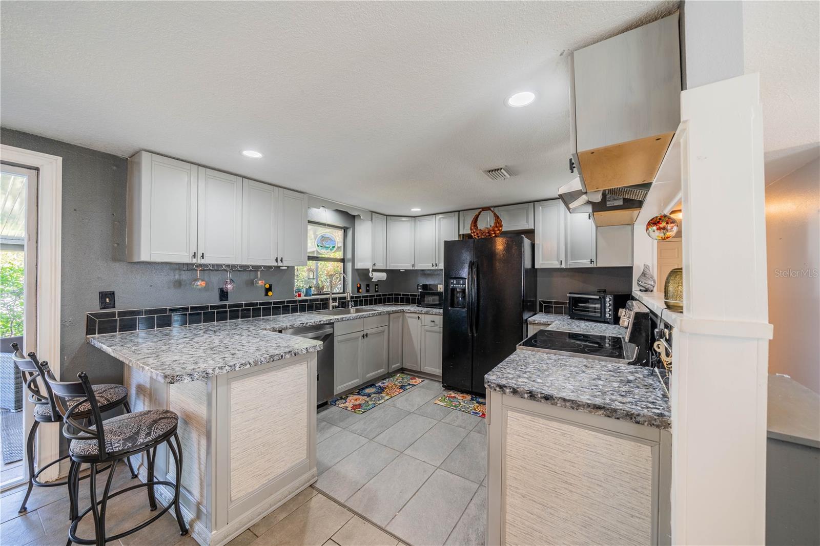 CABINETS HAVE BEEN REFINISHED AS WELL AS COUNTERTOPS