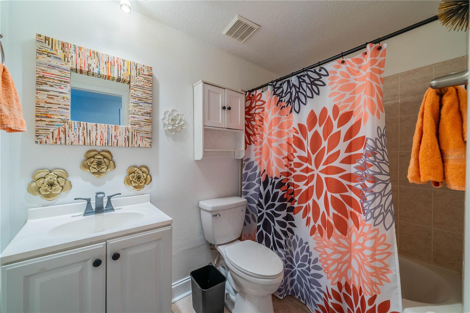 GUEST BATH HAS NEWER VANITY AND FULL TUB AND SHOWER