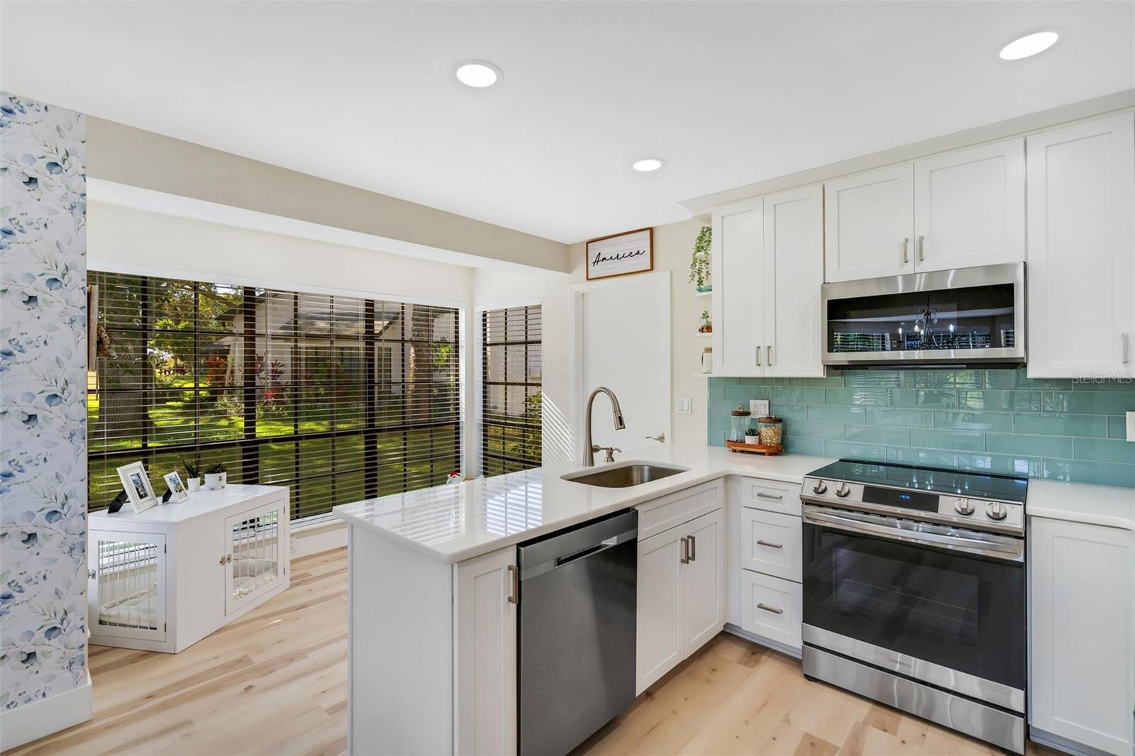 Efficient design with open counter & breakfast nook surrounded by green golf views~