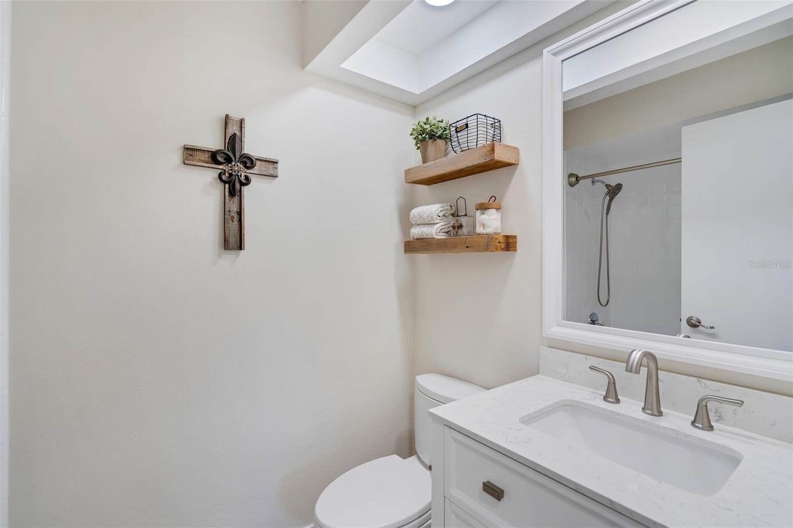 Hall bath nicely located between main living & guest suite offering updates and shower/tub combo~