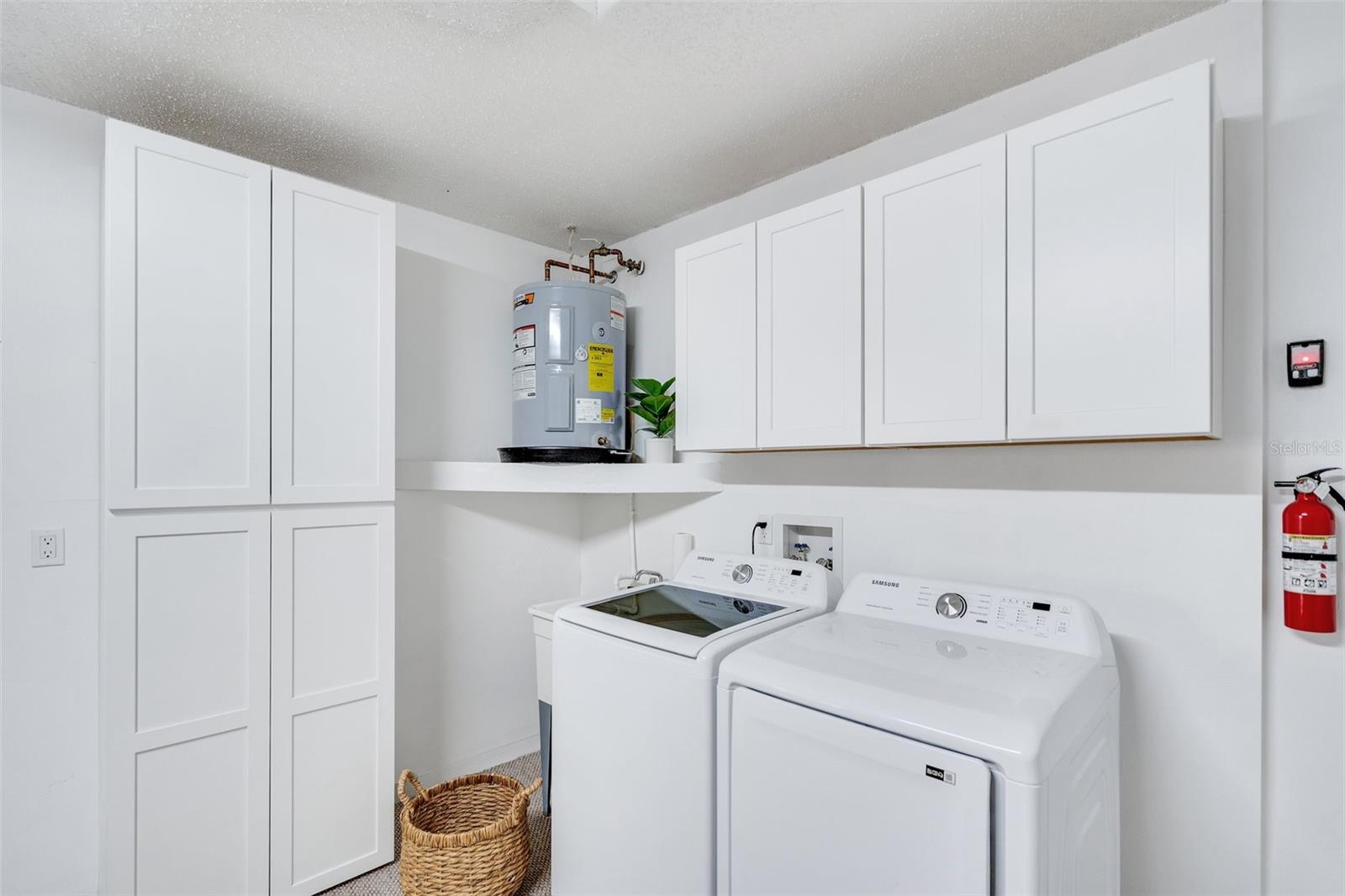 Convenient laundry station and newer cabinetry for extra storage & organization~