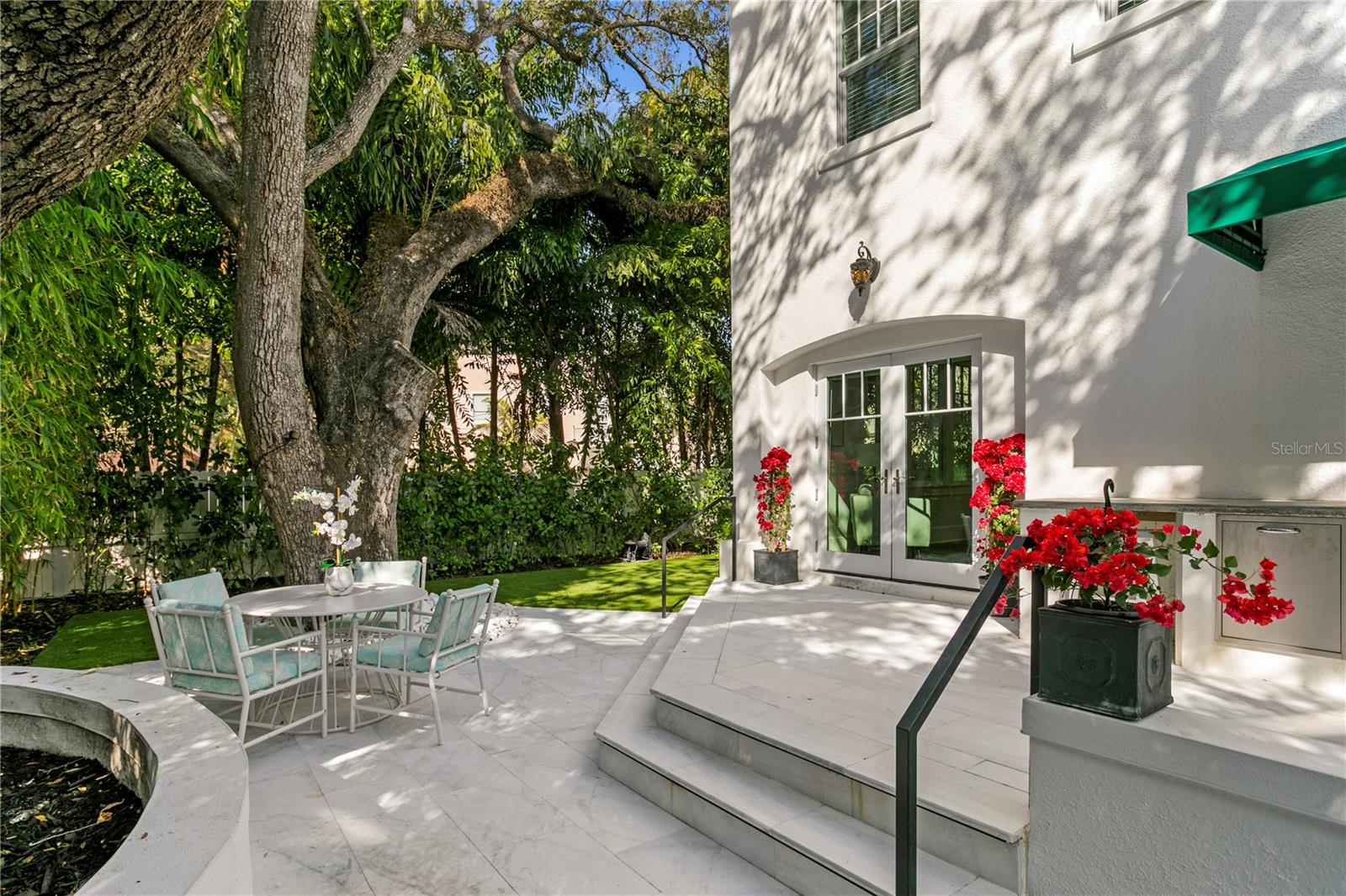 Gorgeous French doors lead you out to the private oasis backyard where you will find the perfect place to entertain under the grand oaks shade.