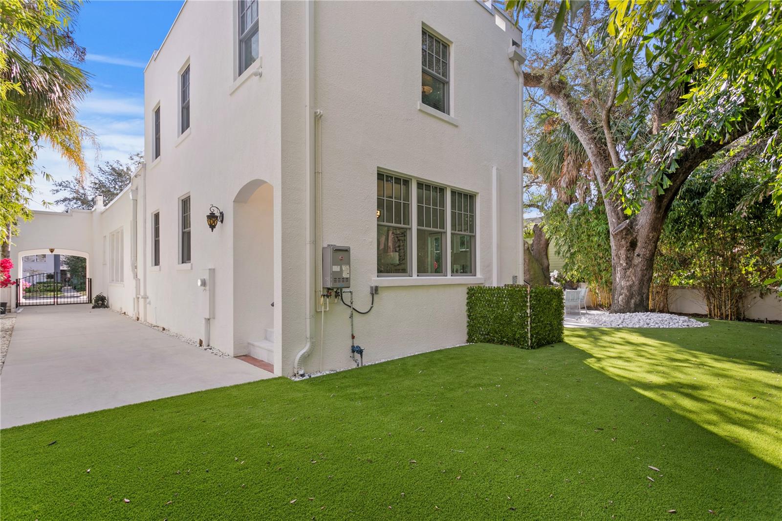 The extended driveway along the house