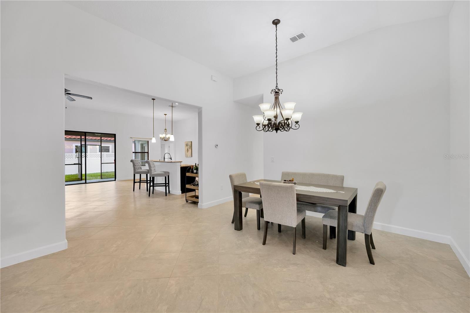 Just beyond the Dining room is a hallway leading to 2 secondary bedrooms, a laundry room and a full bathroom.