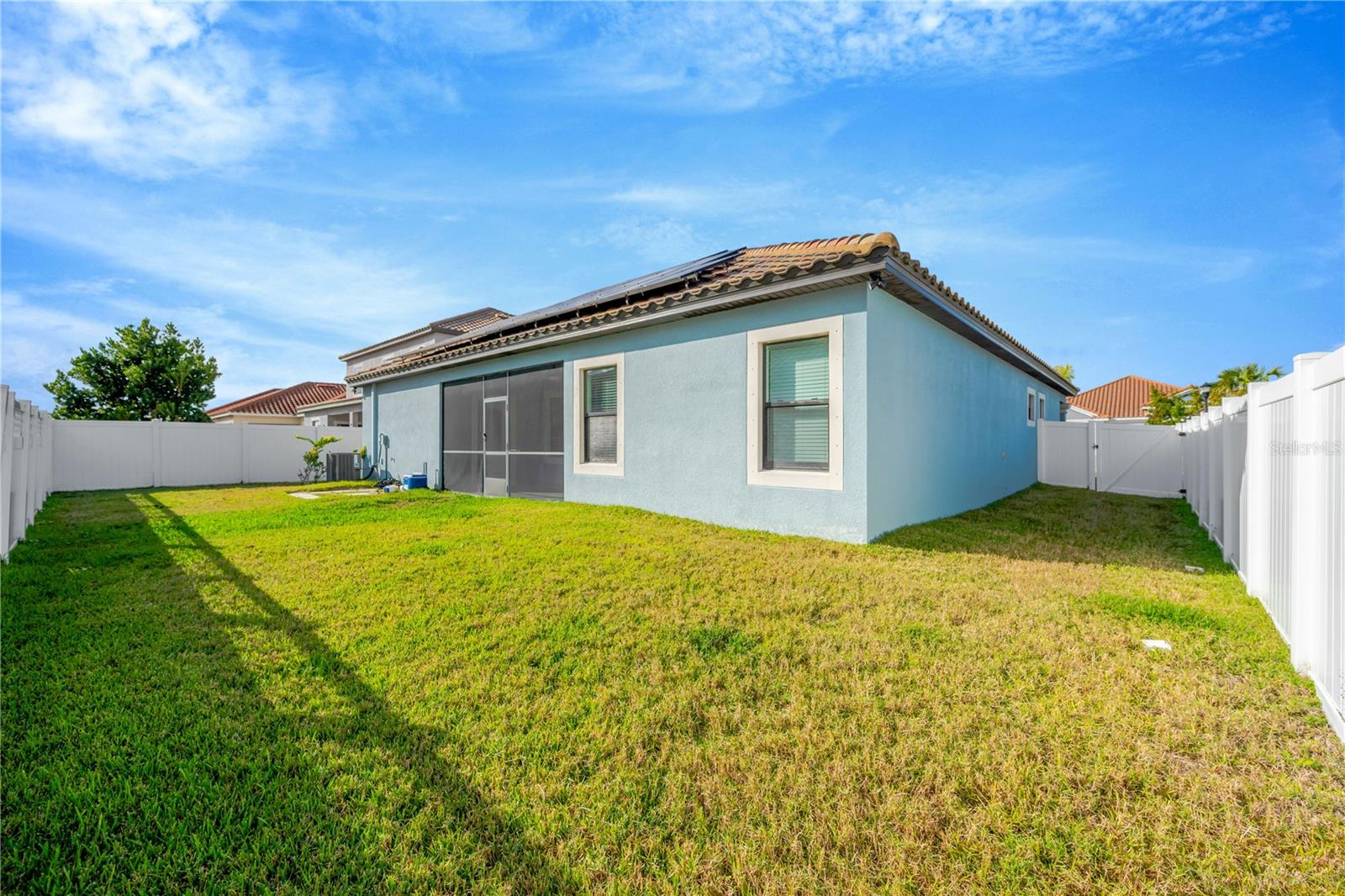 This home is on a corner lot and is totally fenced with 2 gates - 1 on each side.