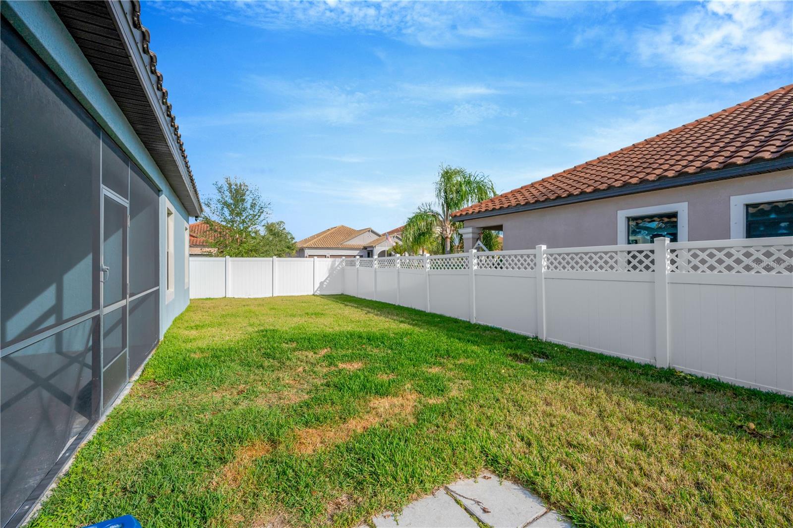 This home is on a corner lot and is totally fenced with 2 gates - 1 on each side.