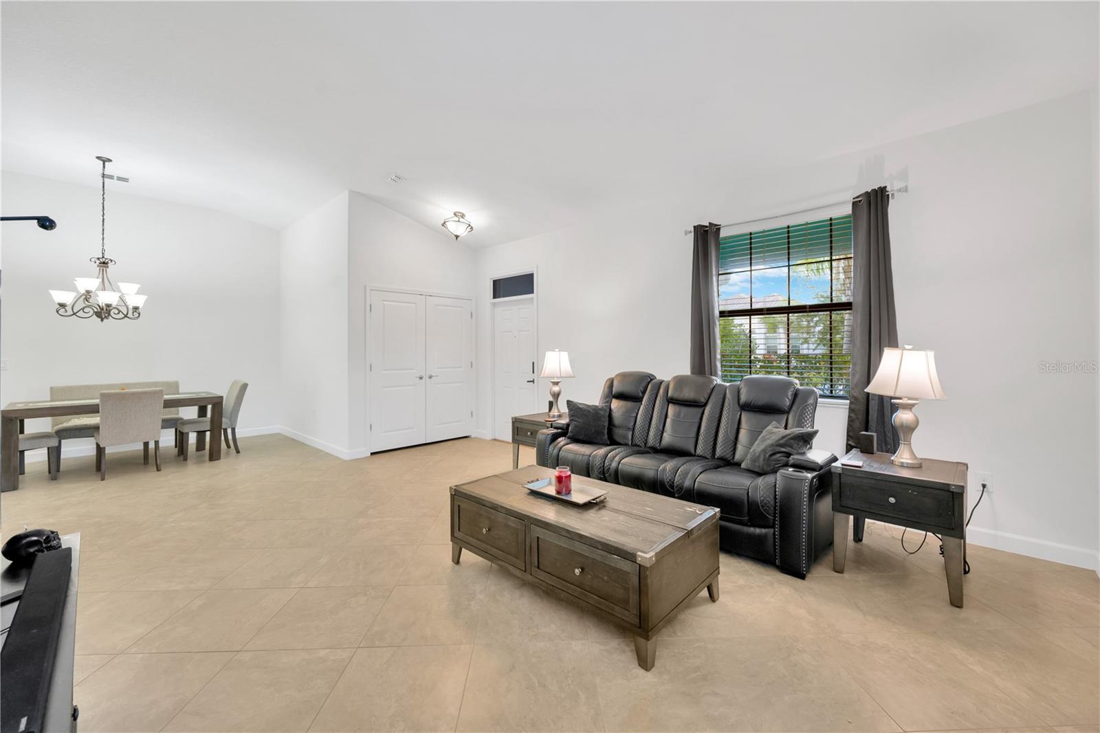 Living room is spacious with high quality tile installed in a diagonal arrangement to bring unique character and visual interest.