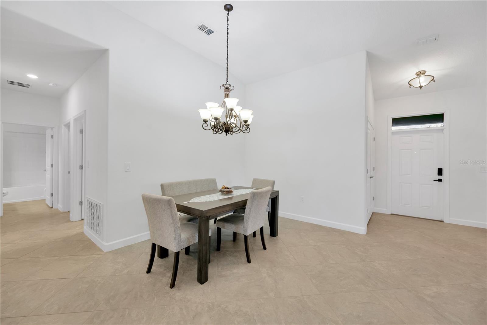 Just beyond the Dining room is a hallway leading to 2 secondary bedrooms, a laundry room and a full bathroom.