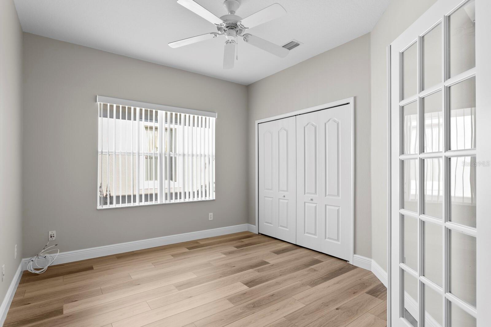 French doors open into the 2nd bedroom